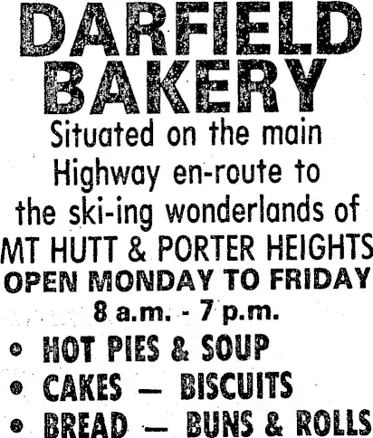 Black and white advertisement for Darfield Bakery, listing hours (8 a.m. - 7 p.m.) and menu items like hot pies, soup, cakes, biscuits, bread, buns, and rolls.